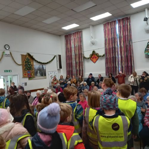 Reception children sing to the U3A community